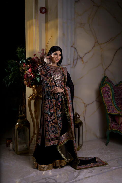 Black heavy embroidered bridal dress and gharara with heavy bordered voile dupatta